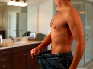 Man In Bathroom Measuring Weight Loss From Bigger Fiting Pants
